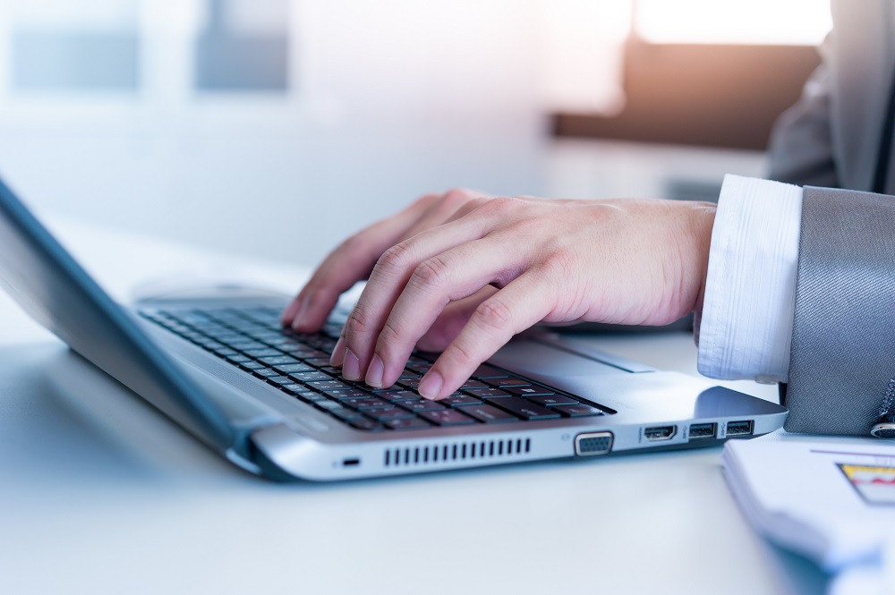 Typing on laptop